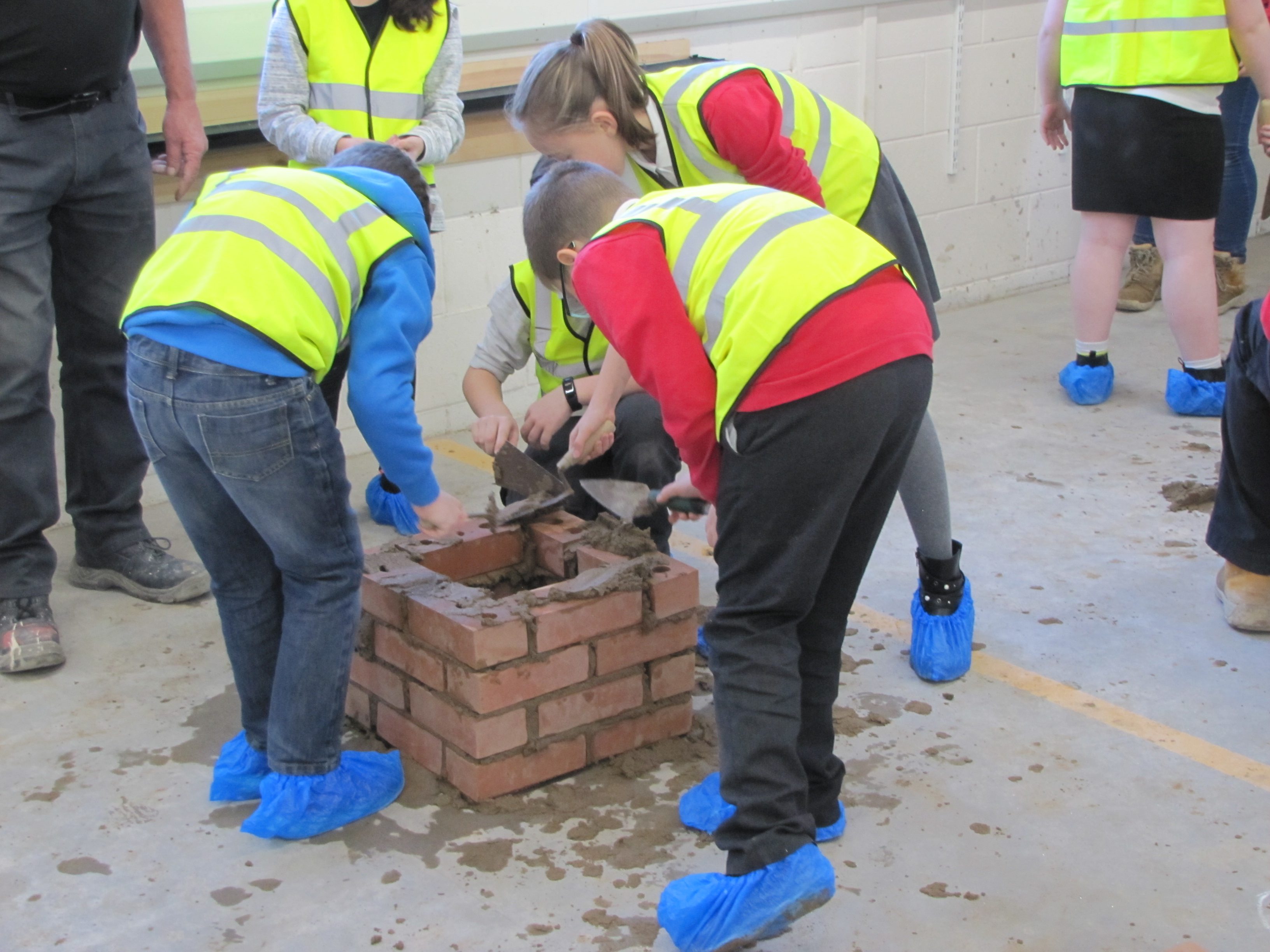 Young people taking part in bricklaying skills